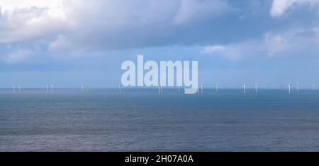 Gwynt y Môr (Sea wind) 576-megawatt offshore electricity generating wind farm; 160 x 150m high wind turbines in action, Colwyn Bay Wales Stock Photo
