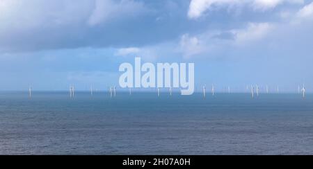 Gwynt y Môr (Sea wind) 576-megawatt offshore electricity generating wind farm; 160 x 150m high wind turbines in action, Colwyn Bay Wales Stock Photo