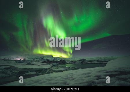 Northern Lights and Aurora Borealis over Joekulsarlon Glacier Lagoon in South Iceland Stock Photo