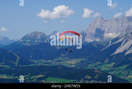 two friends paragliding in the Alps of the Dachstein region in Austria Stock Photo