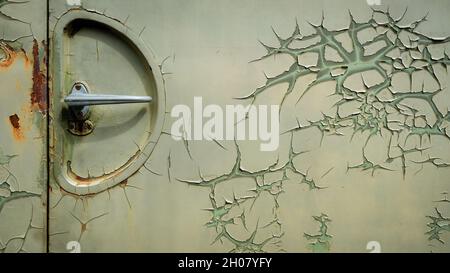 Door handle with rust and peeling paint on old military vehicle Stock Photo