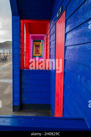 Colourful beach huts on the promenade at Saltburn by the Sea. Stock Photo