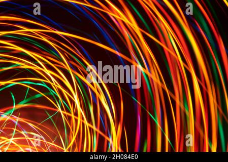 Abstract spiral light lines background, dynamic colorful image. Stock Photo