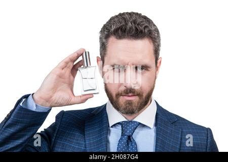 businessman man in suit presenting cosmetic product of mens perfume isolated on white, male beauty. Stock Photo