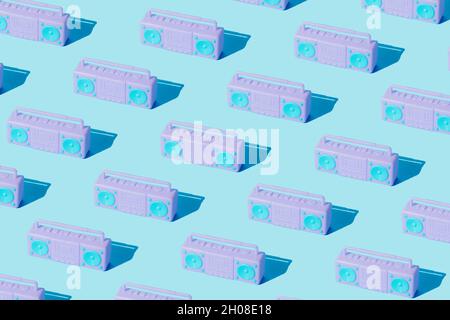 Retro kids toy cassette deck player pattern on trendy pastel blue background. Creative layout. Retro technology idea. Minimal abstract music and party Stock Photo