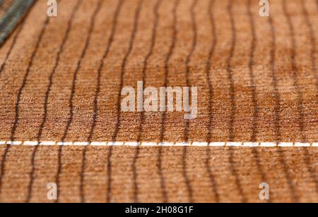 Close-up tennis net shadow on the clay tennis court. Perspective lines on the ground surface, made by net shadows Stock Photo