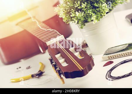 Restring classical guitar concept. Closeup at the new strings. Stock Photo