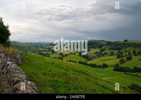 Upper Dovedale in Derbyshire Peak District National park England UK, English countryside, Cloudy evening, Staffordshire county boundary rural farmland Stock Photo