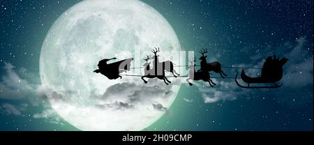 Super Santa Claus Man, a super hero flying over the full moon leading his reindeer at night Christmas. Stock Photo