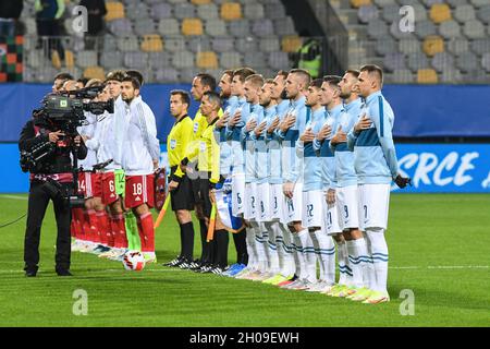Maribor, Slovenia. 11th Oct, 2021. Teams of Slovenia and Russia seen during national anthems before the 2022 FIFA World Cup Group H Qualifier match between Slovenia and Russia. (Final score; Slovenia 1:2 Russia) (Photo by Milos Vujinovic/SOPA Images/Sipa USA) Credit: Sipa USA/Alamy Live News Stock Photo