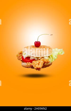 Juicy flying fish burger, hamburger or cheeseburger with one fish patties. Concept of American fast food. Copy space Stock Photo