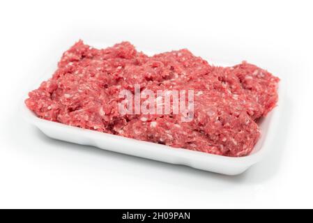 Raw minced meat in a white tray on a white background Stock Photo