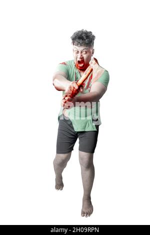 Scary zombie with blood and wound on his body holding ax standing isolated over white background Stock Photo