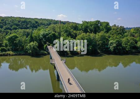 '23.07.2021, Germany, North Rhine-Westphalia, Witten - Ruhr landscape, Nachtigall bridge over the Ruhr in the Muttental valley, in the back chimney of Stock Photo