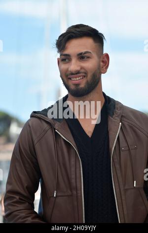 74th edition of the Cannes Film Festival: actor Gimi Nicolae Covaci posing during a photocall for the film “Mi Iubita Mon Amour”, directed by Noemie M Stock Photo