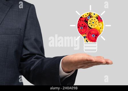 Business concept background with gears inside light bulb icon Stock Photo