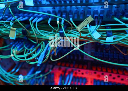 Cables connected to patch panel of server rack Stock Photo