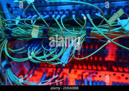 Patch panel of server cabinet with network cables Stock Photo