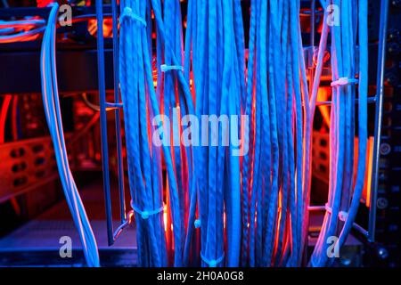 Bunch of twisted pair cables in server cabinet Stock Photo