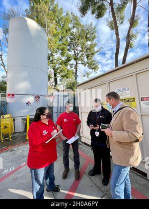 Three professionals with the U.S. Army Corps of Engineers Los Angeles District capture information and discuss it with Ryan Berry, second from right, director of health care for Howe Bonney & Associates, during a site assessment at Providence Holy Cross Medical Center in Mission Hills, California, Jan. 5, 2021. From left to right are Pat Vasquez, a civil engineering technician and mission manager with the LA District; Chad D. Allen, resident engineer with the LA District’s Edwards Air Force Base Resident Office; Berry; and Justin Gay, an LA District program manager. The Los Angeles District, U Stock Photo