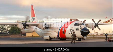 An Air Station Barbers Point HC-130 Hercules aircrew search for the crew of the fishing vessel Yong-Yu-Sing No. 18, 550-miles northeast of Midway Island, Jan. 12, 2020. The crew of the fishing vessel are believed to be onboard a life raft promoting a search that had been ongoing since Dec. 31, 2020. Stock Photo