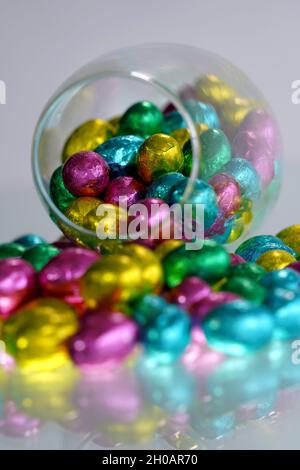 Multi-colored Easter eggs wrapped in foil. Stock Photo