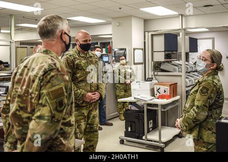 U.S. The Air Force Expeditionary Center command team is briefed on COVID-19 sample testing procedures during their visit to the 87th Air Base Wing at Joint Base McGuire-Dix-Lakehurst, New Jersey, Jan. 13, 2021. The 87th MDG lab technicians are critical in determining whether or not a patient has contracted COVID-19 by analyzing blood samples. Stock Photo