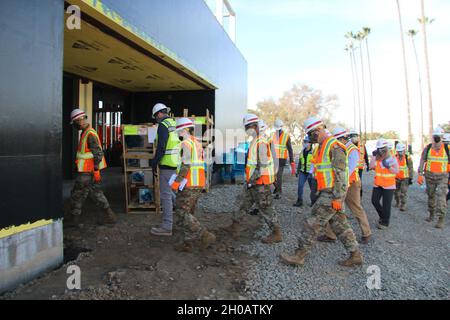 Top leaders with the U.S. Army Corps of Engineers conduct a walkthrough of an under-construction mental health facility Jan. 13, 2021, at the Veterans Affairs Long Beach Healthcare System complex in Long Beach, California. The visitors included Lt. Gen. Scott A. Spellmon, left, U.S. Army Corps of Engineers commanding general and chief of engineers; Command Sgt. Maj. Patrickson Toussaint, fourth from left, USACE command sergeant major; and Brig. Gen. Paul E. Owen, fifth from left in foreground, USACE South Pacific Division commander. On site representing the Los Angeles District were Col. Julie Stock Photo