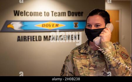 Senior Airman Kristina Grafton, 436th Operation Support Squadron airfield management operations supervisor, tests the base crash phone at Dover Air Force Base, Delaware, Jan. 14, 2021. As an airfield management journeyman, Grafton manages airfield operations, which includes coordinating with civil engineers, safety, air traffic control and various other base agencies to ensure safe aircraft operations within the airfield of Dover AFB. Airfield management is responsible for conducting daily tests of the crash telephone network. Stock Photo