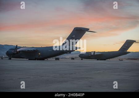 A 172d Airlift Wing and a 105th Airlift Wing C-17 Globemaster III wait on the 124th Fighter Wing flight line in Boise, Idaho, Jan. 15, 2020 to take more than 300 Idaho National Guard citizen-Soldiers and Airmen to Washington, D.C. to participate in the presidential inauguration. These Guardsmen will augment the D.C. National Guard and serve in support of the U.S. Secret Service, the lead federal agency responsible for coordinating the event. The Nation’s Guard response includes approximately 21,000 Guard members from nearly all states and territories. Stock Photo