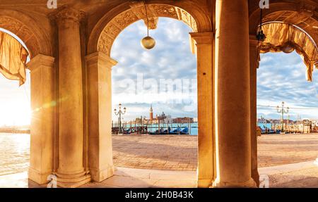 San Giorgio Maggiore Island behind the olumns on San Marco Square, Venice, italy. Stock Photo