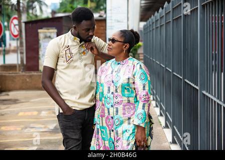 happy beautiful young couple talking on the street posing together smiling Stock Photo