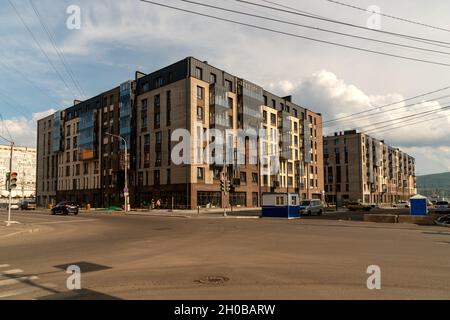 New brick houses under construction on the former territory of the Krasnoyarsk Combine Plant in the city center on a summer day. Russia. Stock Photo