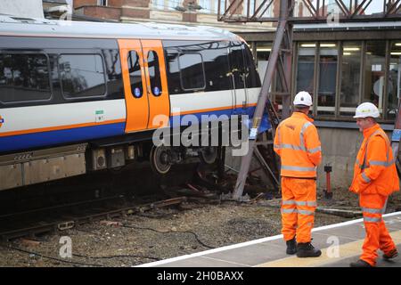 LONDON, UK 12 OCTOBER 2021: Network Rail engineers look on at the scene at Enfield Town station in Southbury Road, Enfield, London this morning after Stock Photo