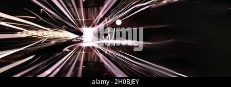 Closeup of bright sparks from laser cutting of metal Stock Photo