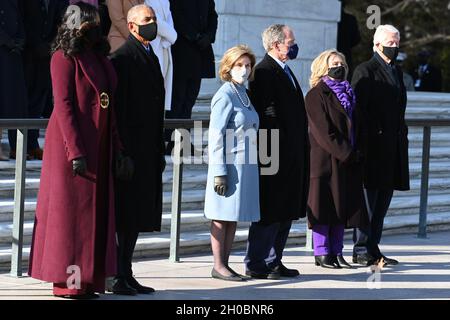 From left to right: former first lady Michelle Obama, former President Barack Obama, former first lady Laura Bush, former President George W. Bush, former Secretary of State Hillary Clinton and former President Bill Clinton, attend a wreath-laying ceremony at Arlington National Cemetery in Arlington, Va., Jan. 20, 2021. The ceremony was part of the 59th Presidential Inauguration during which Obama's former Vice President, Joseph R. Biden Jr., was sworn in as the 46th President of the United States. Stock Photo