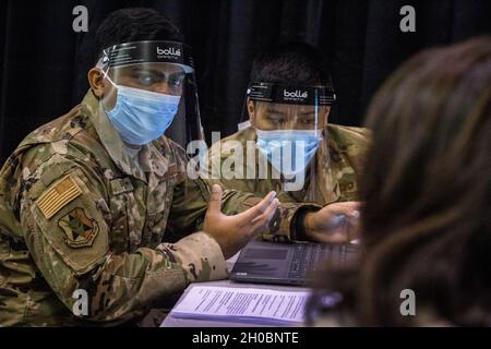 U.S. Air Force Airmen with the 177th Fighter Wing, New Jersey Air National Guard, enter information on an individual receiving the COVID-19 vaccination at the newly opened COVID-19 vaccination mega-site at the Atlantic City Convention Center, Atlantic City, N.J., Jan. 20, 2021. Citizen-Airmen are supporting health care workers at the mega-site, which is one of six mega-sites statewide. The others are in Bergen, Burlington, Gloucester, Middlesex, and Morris counties. (New Jersey Stock Photo