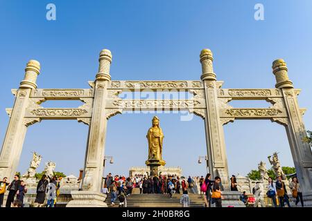 Zhejiang, China - 03 November 2017: Golden Guan Yin Buddha statue. Stock Photo