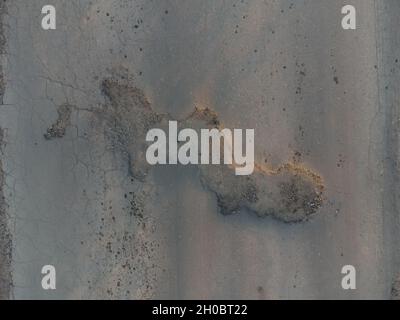 Top view of asphalt with pit and pothole. Broken road. Stock Photo