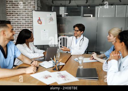 Chief physician holding digital tablet with blank screen Stock Photo