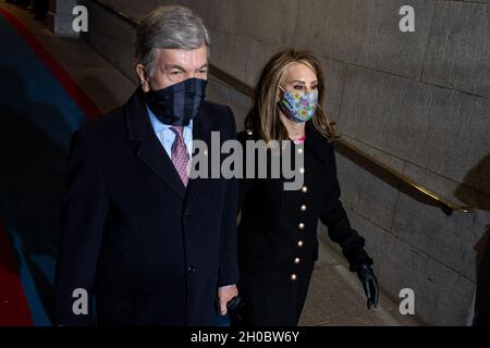 Chairman of the Joint Congressional Committee on Inaugural Ceremonies and his wife walk onto the inaugural platform during the 59th Presidential Inauguration at the U.S. Capitol Building, Washington, D.C., Jan. 20, 2021. Military personnel assigned to Joint Task Force - National Capital Region provided military ceremonial support during the inaugural period. Stock Photo