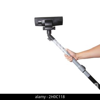 Male hand holds a brush and a pipe of a vacuum cleaner on a white background, isolate. Close-up Stock Photo