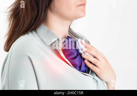 The girl applies a medical bag with cold for injury and removal of edema from the chest Stock Photo