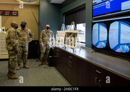 U.S. Air Force Maj. Gen. Thad Bibb, 18th Air Force commander, uses a virtual reality headset at Joint Base McGuire-Dix-Lakehurst, N.J., Jan. 21, 2021. The 18th Air Force Command Team is visiting the 305th Air Mobility Wing to learn how Airmen contribute to the 18th Air Force airlift and aerial refueling missions. Bibb experienced the 305th AMW’s diverse missions, toured new facilities and developed an understanding on the unique opportunities that come with being positioned at Joint Base MDL. Stock Photo