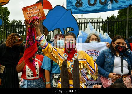 Washington, USA. 11th Oct, 2021. Environmental activists, led by indigenous peoples groups, protest at the White House to call on the U.S. government to combat climate change in Washington, DC on October 11, 2021. (Photo by Matthew Rodier/Sipa USA) Credit: Sipa USA/Alamy Live News Stock Photo