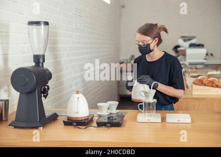 Woman in glasses having hard-working day in cafeteria Stock Photo