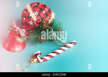 The New Year's composition consists of three toys on a Christmas tree on a blue background. New Year Stock Photo