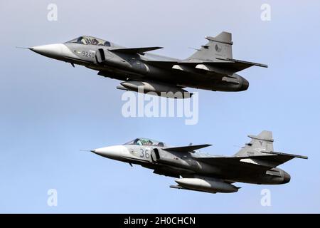 Hungarian and Czech Republic Saab JAS-39C Gripen fighter jets in formation flight over Kleine-Brogel. Belgium - September 13, 2021 Stock Photo