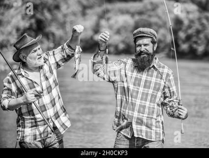 Bound Together In Love. two happy fisherman with fishing rods. summer  weekend. mature men fisher. father and son fishing. hobby and sport  activity. Trout bait. male friendship. family bonding — Stock Photo ©