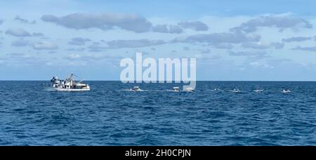 Bahamian fishing vessel, Red Girl, underway, Jan. 25,2021, near Cay Sal, Bahamas. An Air Station Miami HC-144 Ocean Sentry aircrew confirmed the location of the Red Girl on Cay Sal Bank approximately 70 miles east of the disoriented 21-foot fishing skiff. Stock Photo